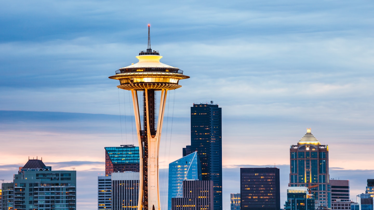 The Space Needle and Seattle skyline at dawn.