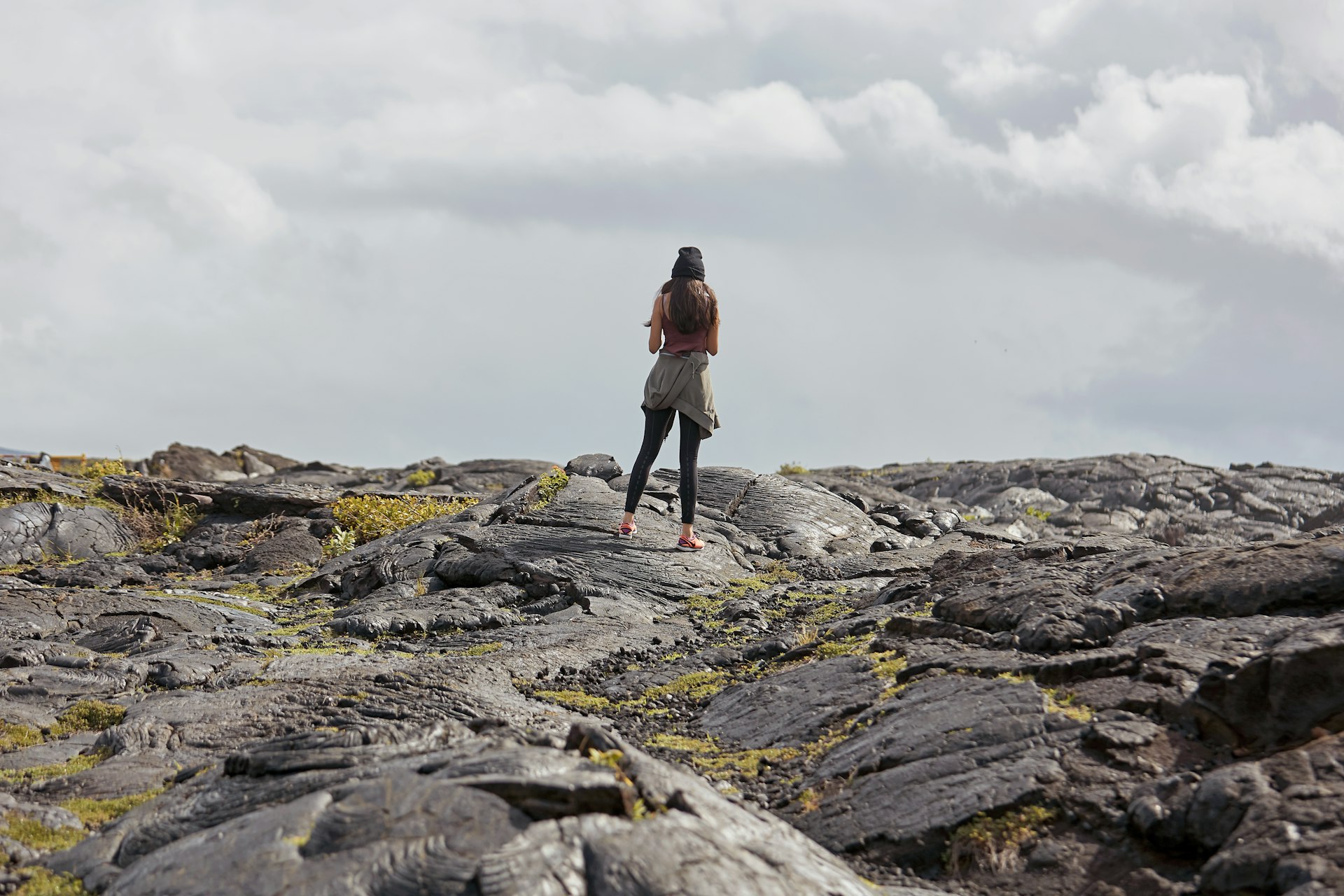 A woman Traveling at Kilauea volcano lava fields Volcano National Park Hawaii
