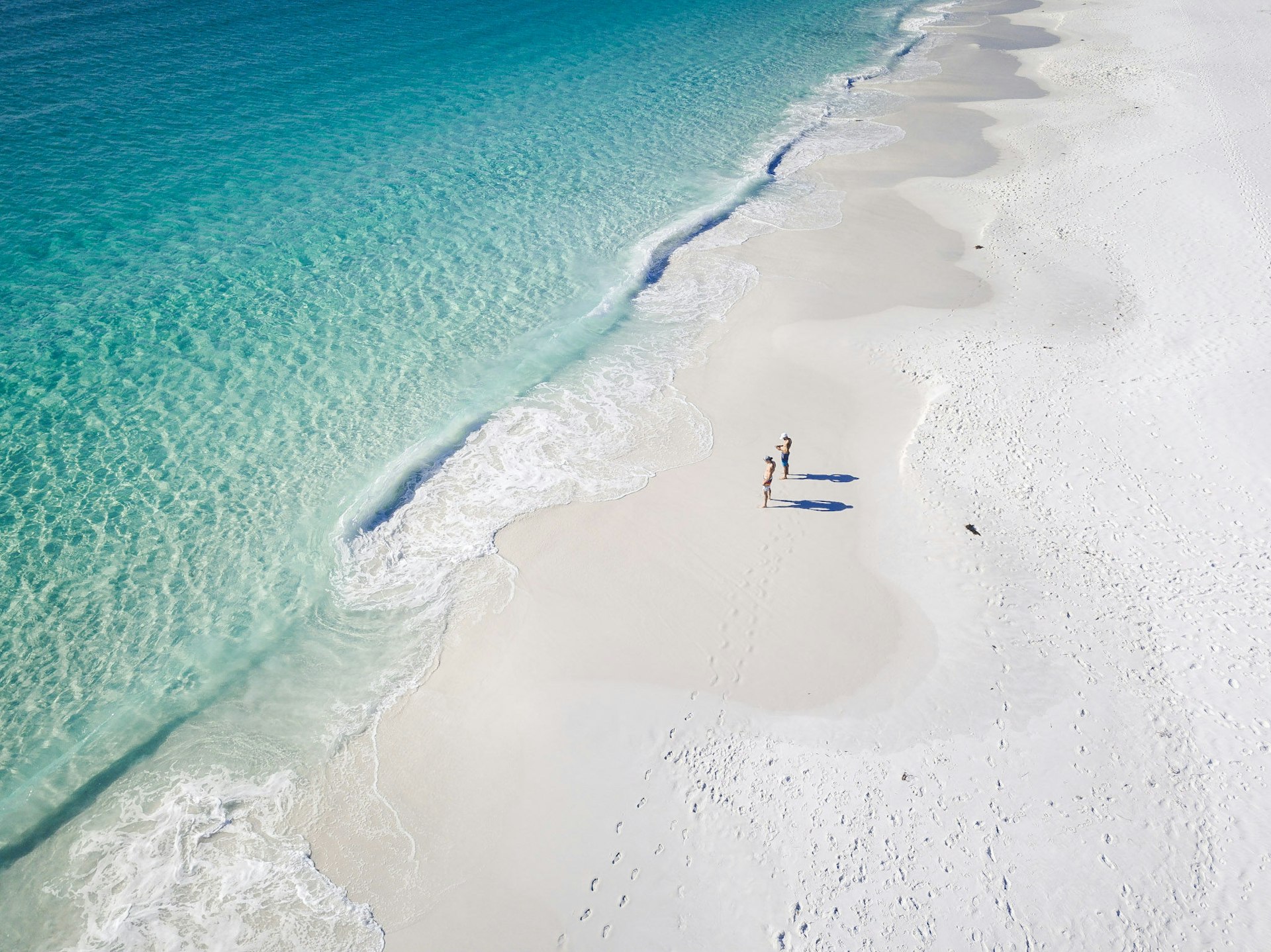High Angle View Of People Standing on the white sands of Hyams Beach in Australia