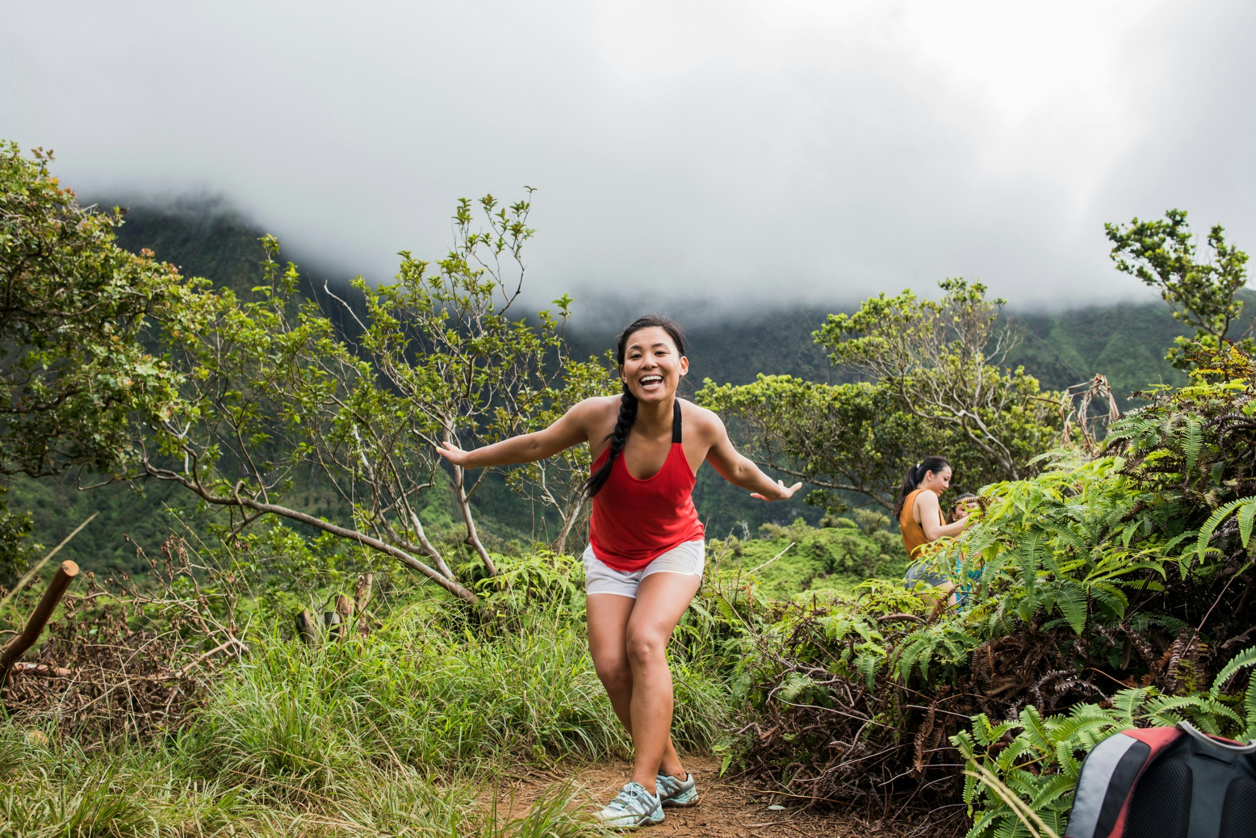 A woman happy among greenery in Hawaii