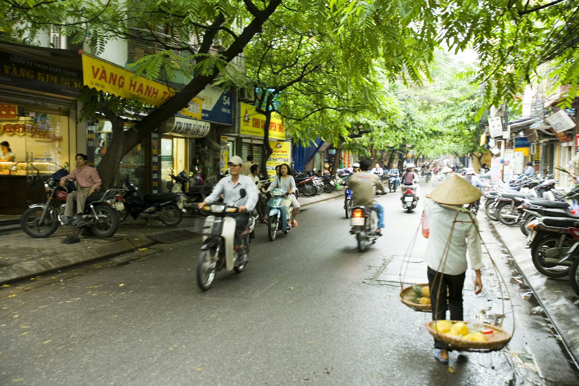 Motorcycles in Han Bac street scene, Old Quarter of Hanoi