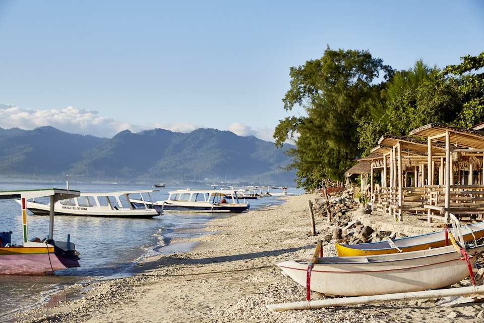 Beach huts and boats on Gili Air island, just off the coast of Lombok.