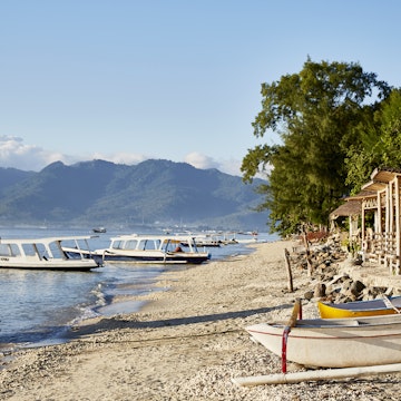 Beach huts and boats on Gili Air island, just off the coast of Lombok.