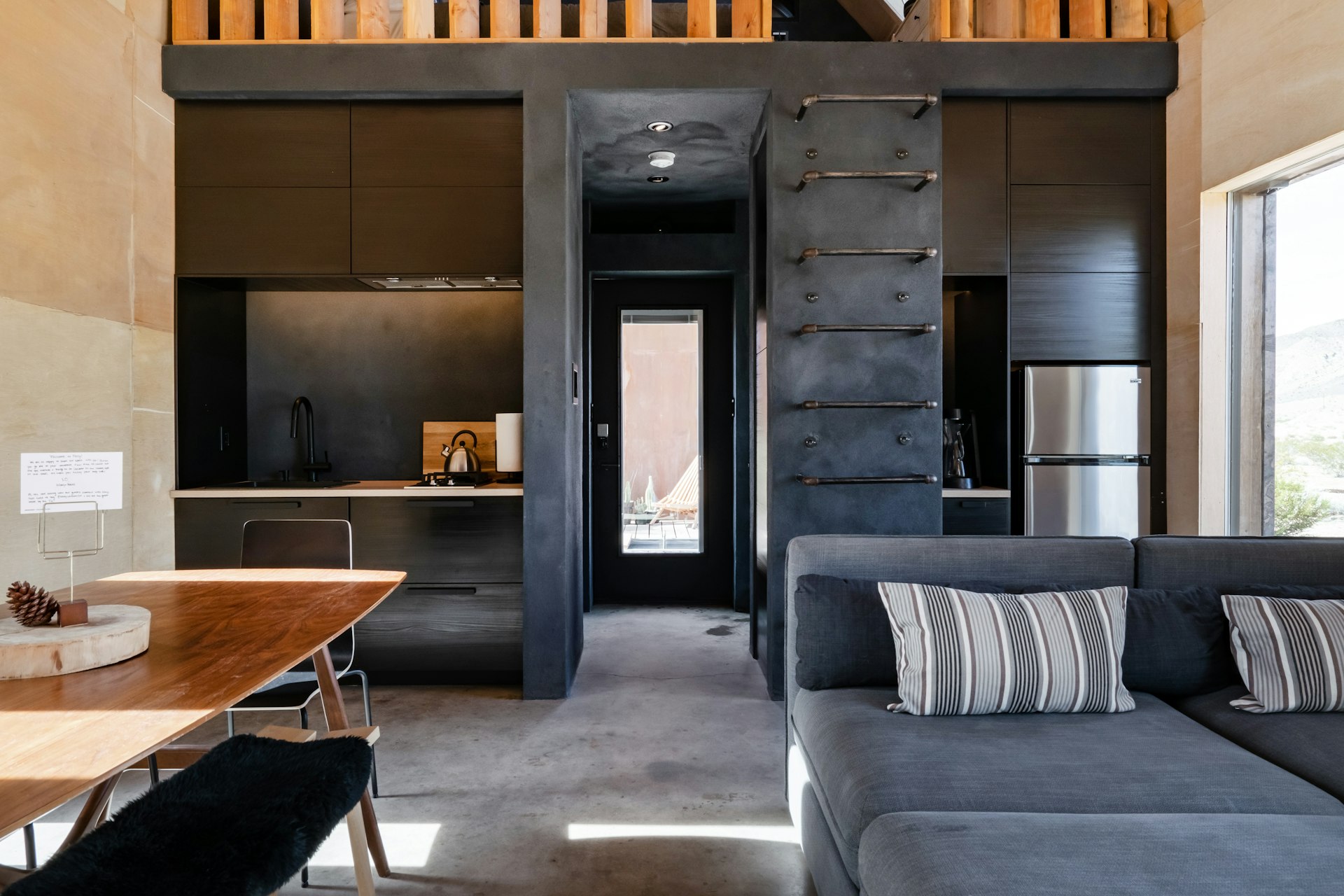 Dark, modern interior of a tiny home in Twentynine Palms, California