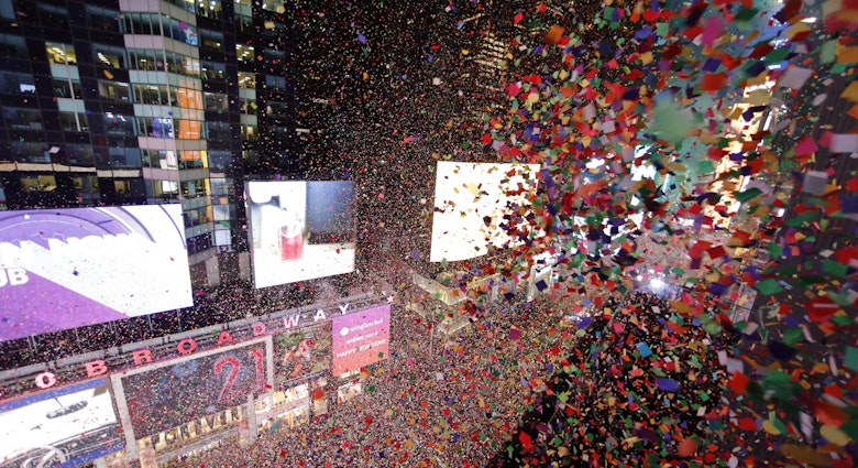 NEW YORK, NY - JANUARY 1: Confetti fills the air over top of revelers during New Year's Eve celebrations in Times Square on January 1, 2020 in New York City. (Photo by Gary Hershorn/Getty Images)