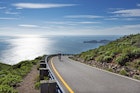 Road along the coastline in Marin Headlands , Cyclist