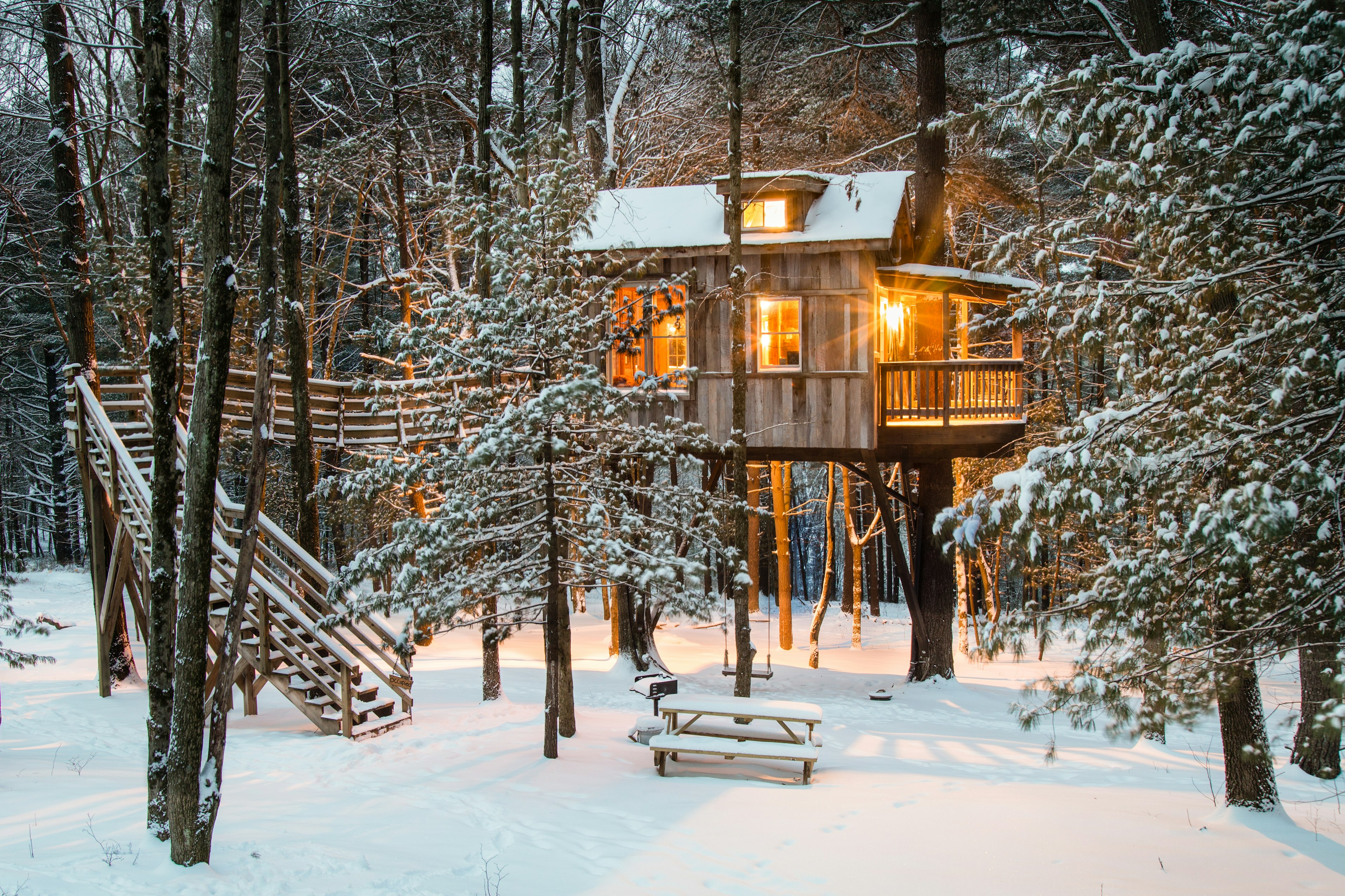 Tree house at The Mohicans surrounded by a snowy landscape in Glenmont, Ohio