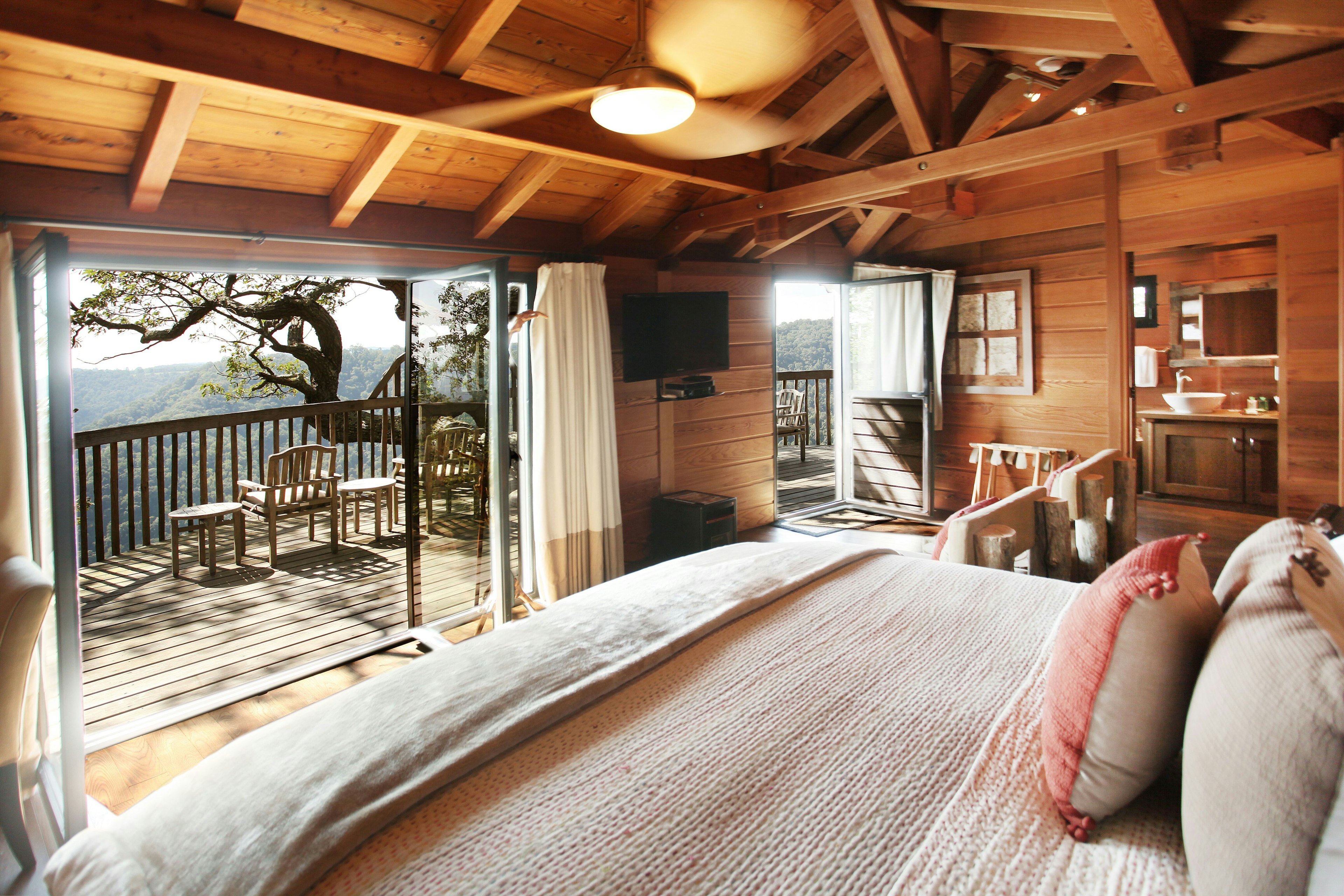 Interior view of a tree house looking out to the balcony at Primland Resort in Dan, Virginia