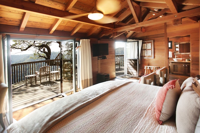 Interior view of a tree house looking out to the balcony at Primland Resort in Dan, Virginia