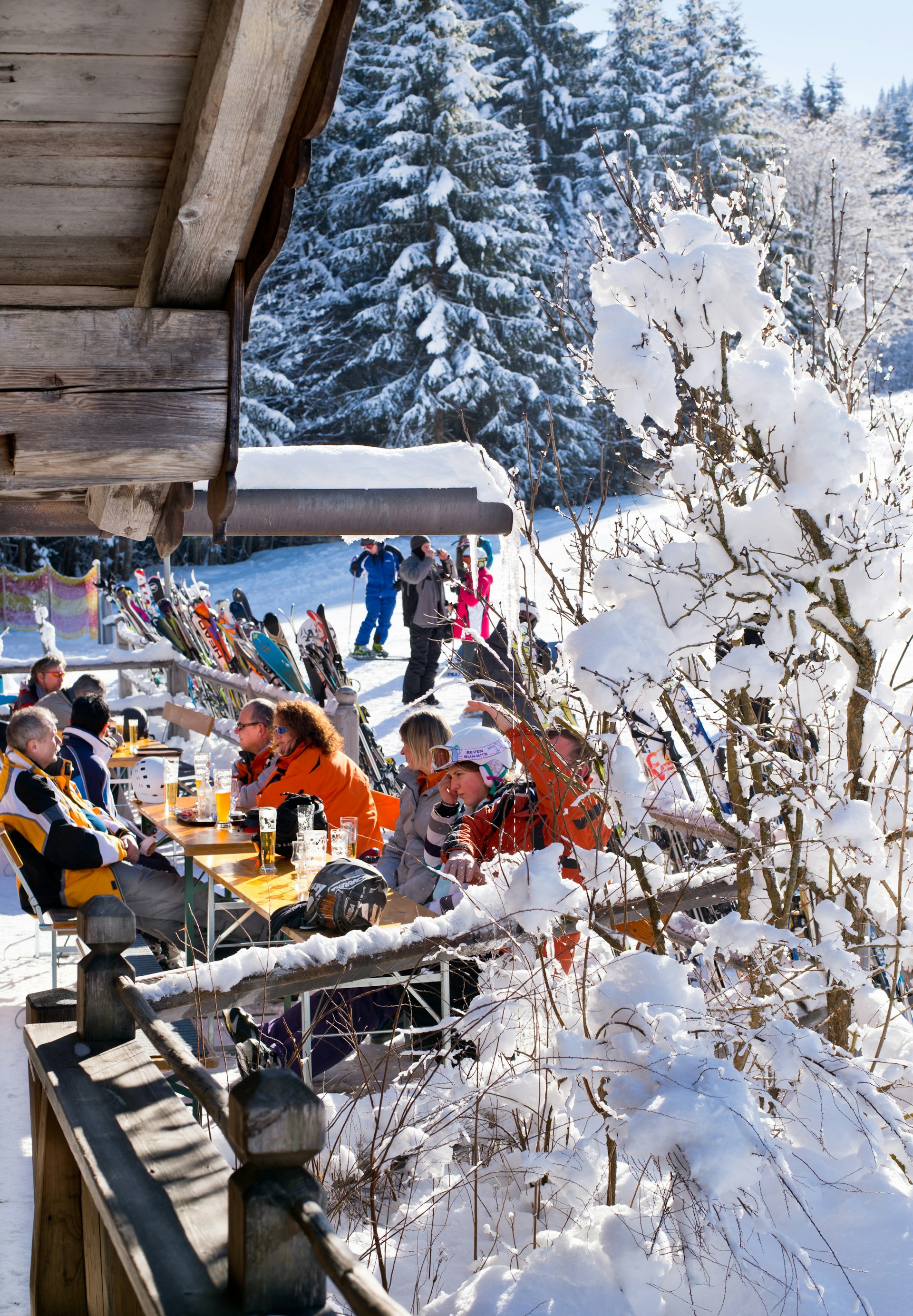 Skiers sitting at a slope bar in Ellmau