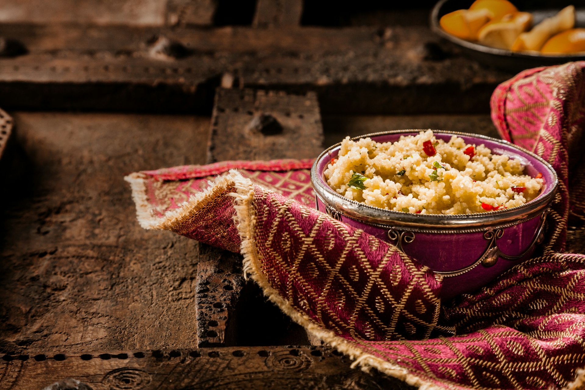 An ornate bowl of traditional Moroccan jeweled couscous.