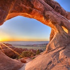 Sunrise at Partition Arch in Arches National Park.