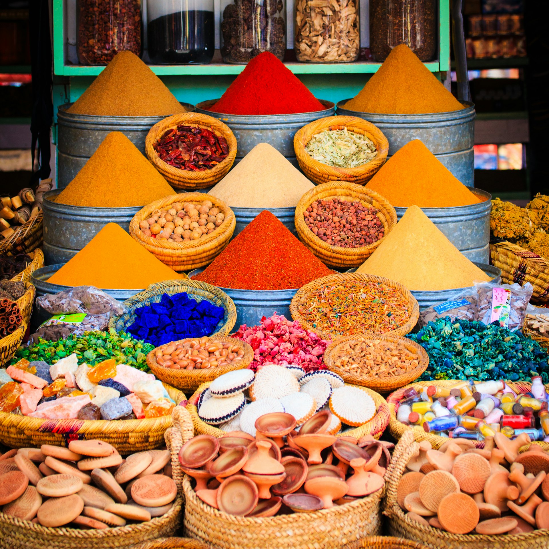 Colorful spices and herbs on display at a moroccan market in Marrakesh