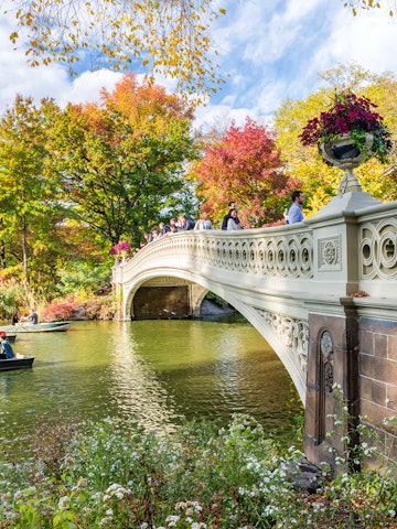 OCTOBER 2015: Visitors paddle in boats near a bridge at Central Park..