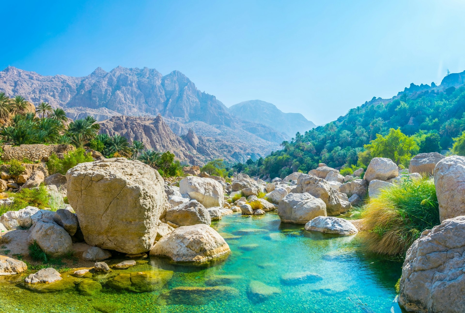 A lagoon with turquoise water in Wadi Tiwi, Oman