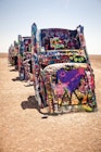 AMARILLO, TEXAS - JULY 10: Famous art installation Cadillac Ranch on July 10,2011 near Amarillo, Texas. It was created in 1974 by C. Lord, H. Marquez and D. Michels and consist from 7 buried Cadillacs