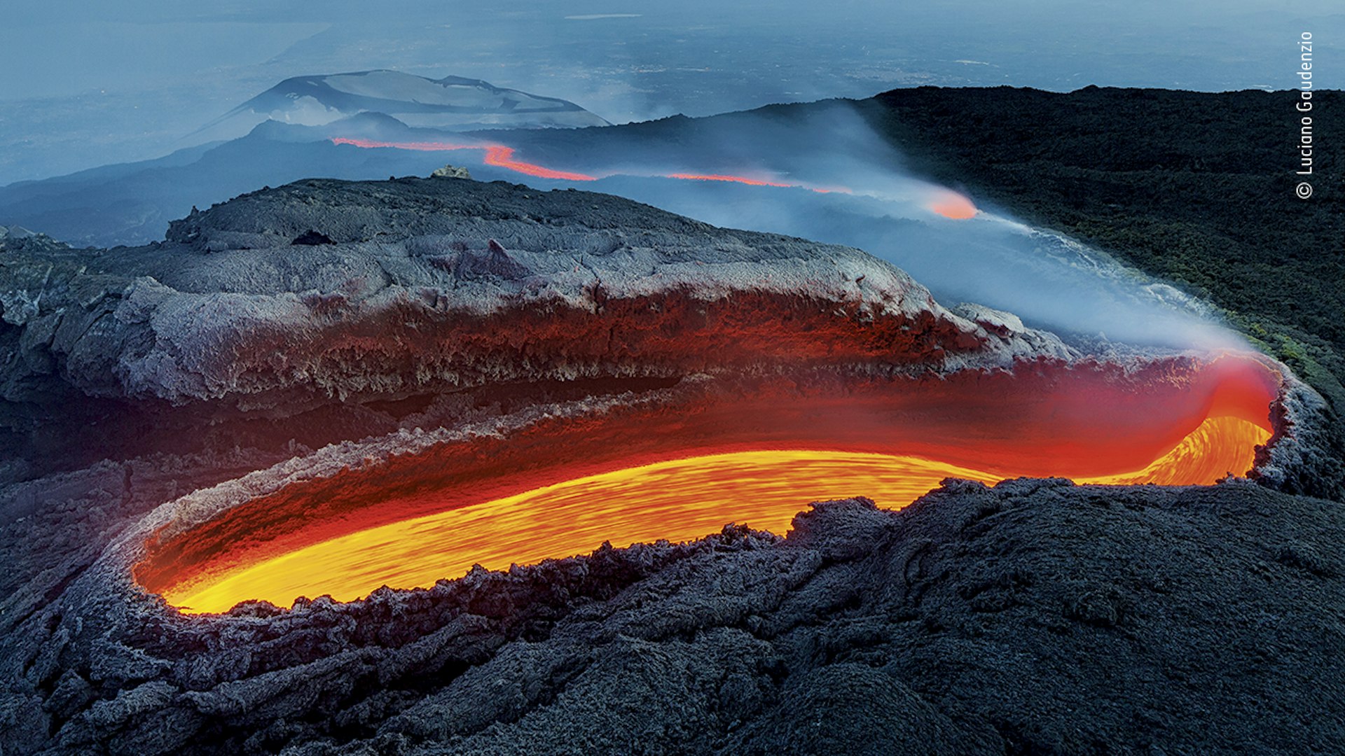 A lava river from Mount Etna flowing into the horizon