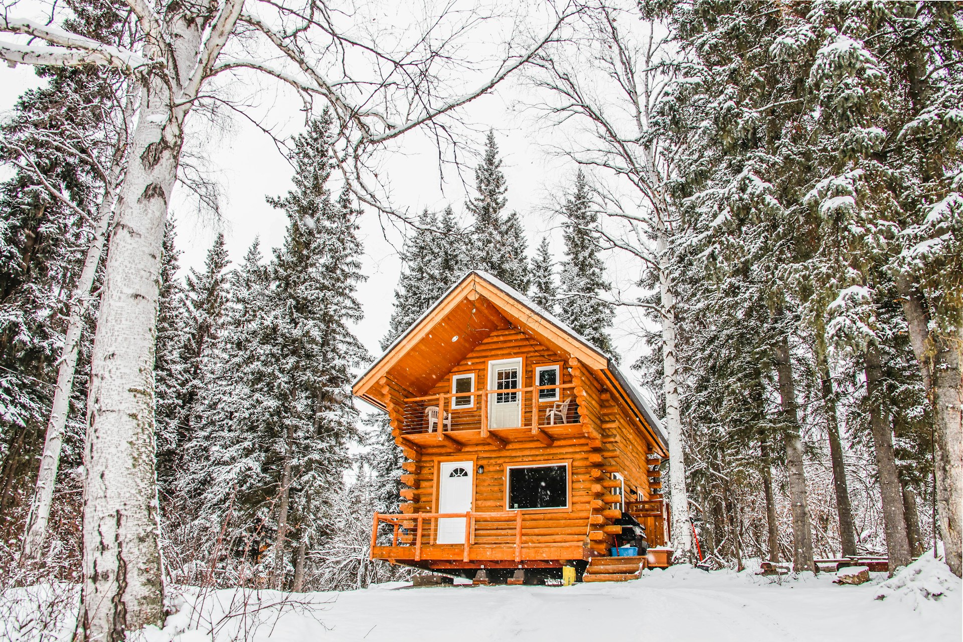 An Alaskan log cabin in the snow