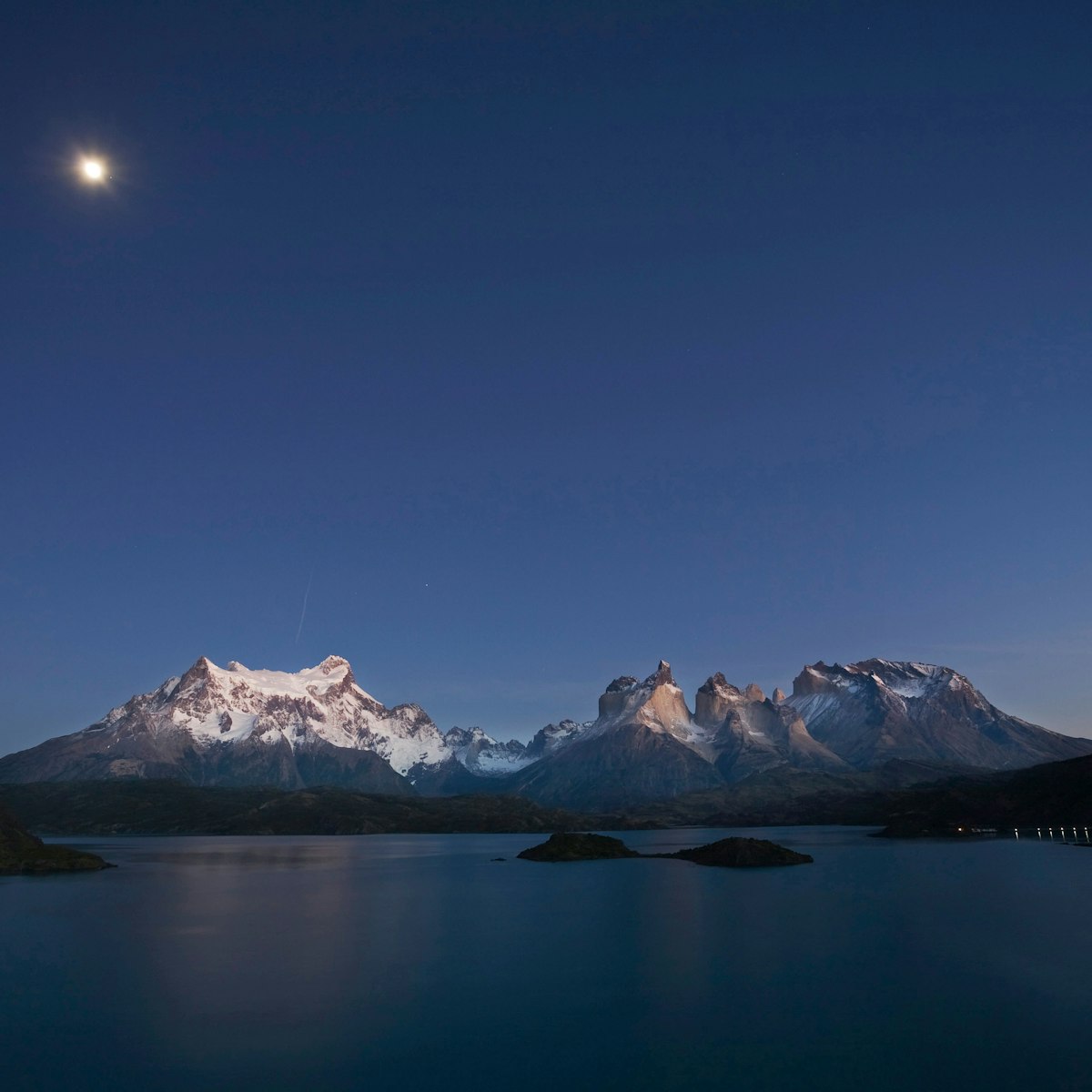 Dawn with moon at the Torres del Paine massif at Lake Lago Pehoe, National Park Torres del Paine, Patagonia, Chile