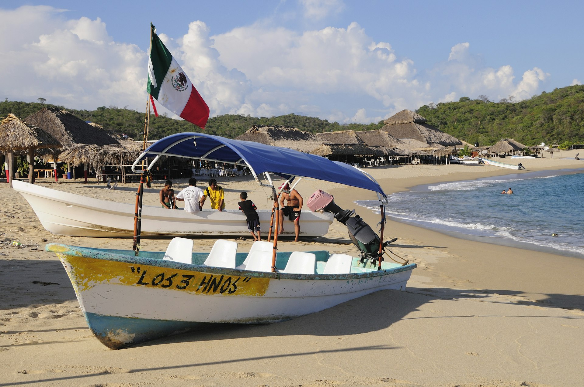 Fishing boats pulled up in front of beach shacks on Bahia San Agustin