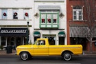 Historic Main Street with antique Yellow Pickup Truck in Franklin, Tennessee, a suburb south of Nashville, Williamson County, Tenn.
