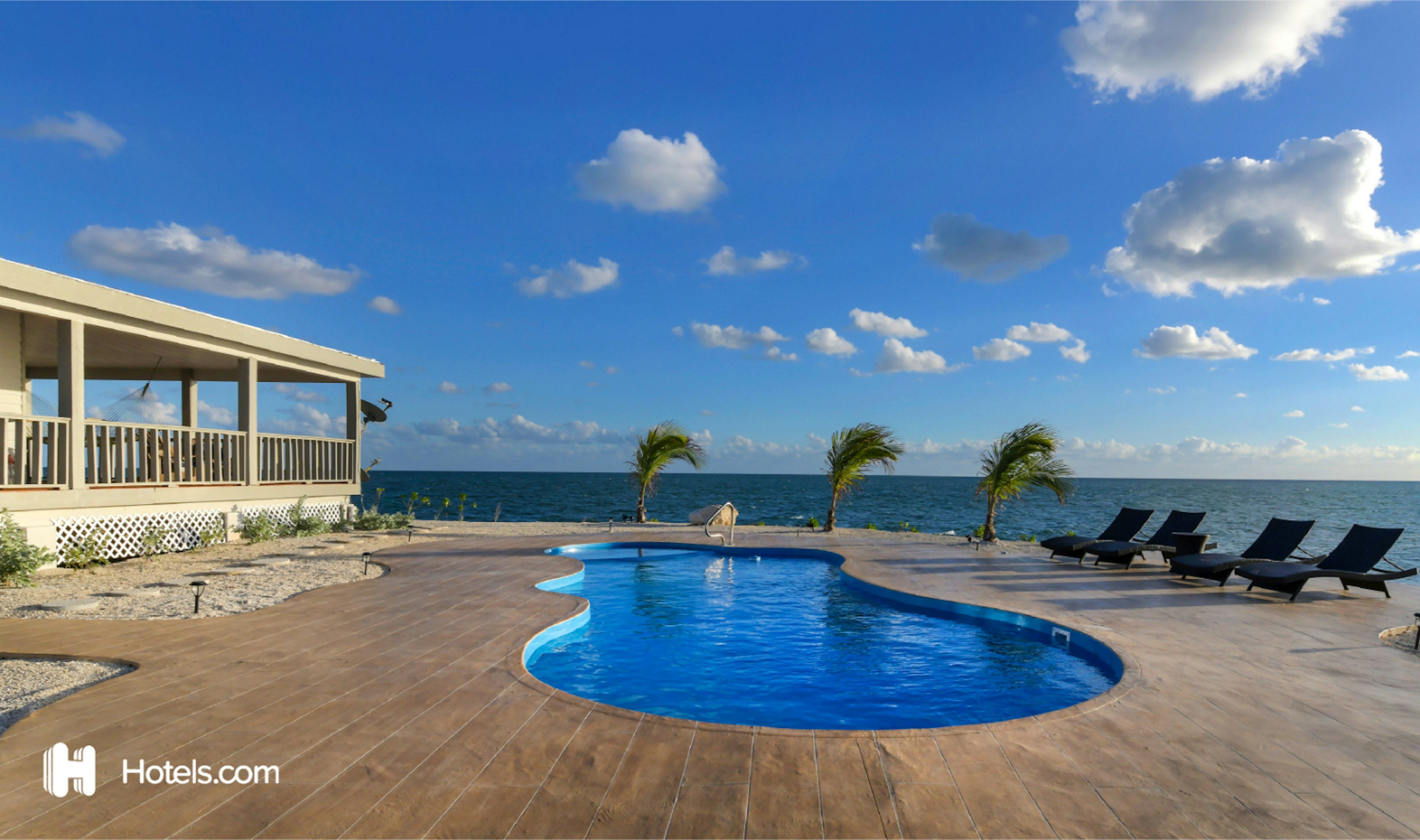 A swimming pool and loungers on Friendsgiving Island