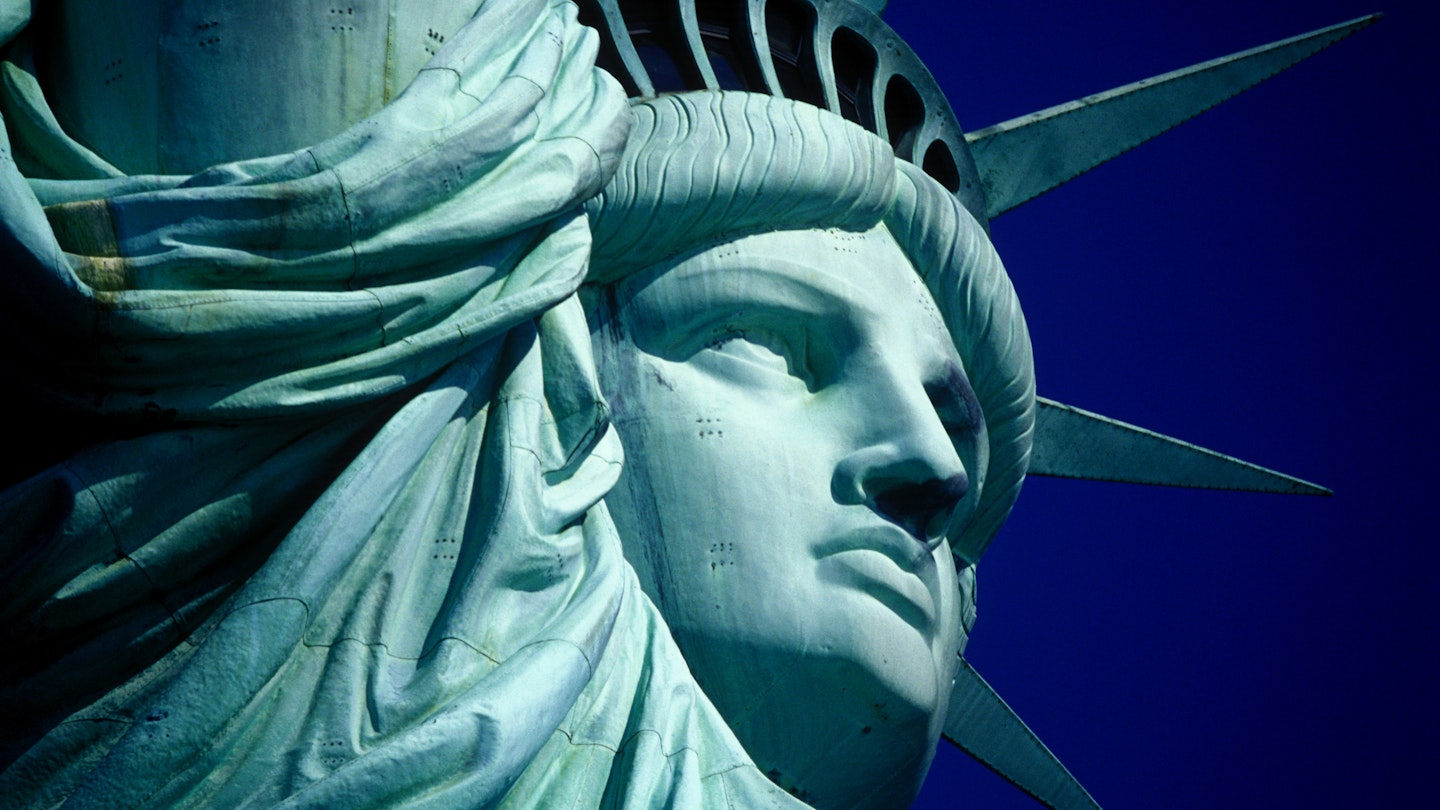 Cropped Image Of Statue Of Liberty Against Clear Blue Sky