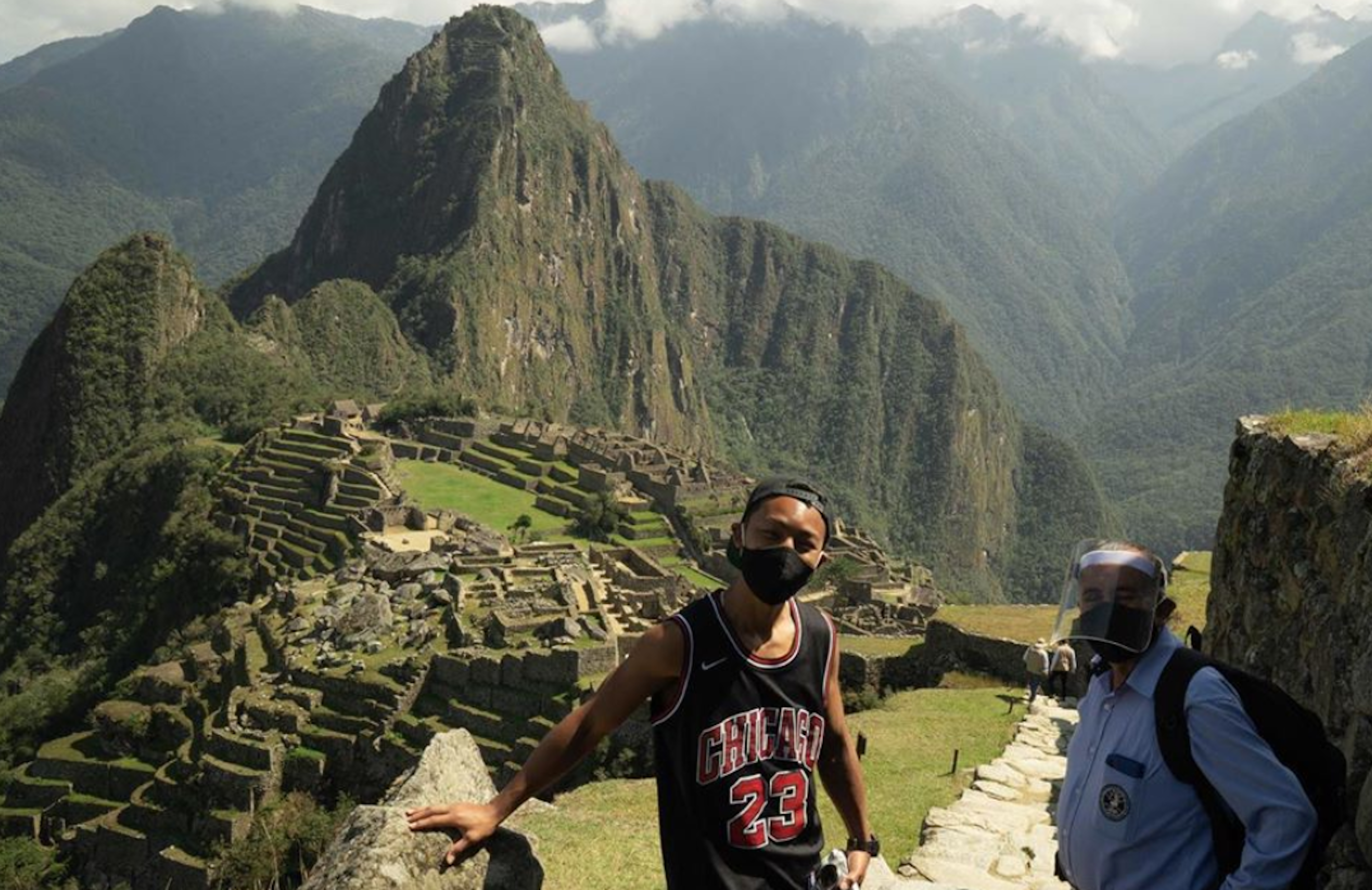 Japanese tourist Jesse Kamayata and a Machu Picchu official on a tour of the World Heritage Site