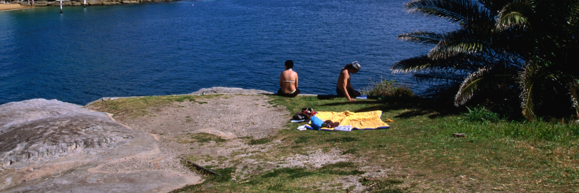 Sunbaking with a view on the bluff at Camp Cove.