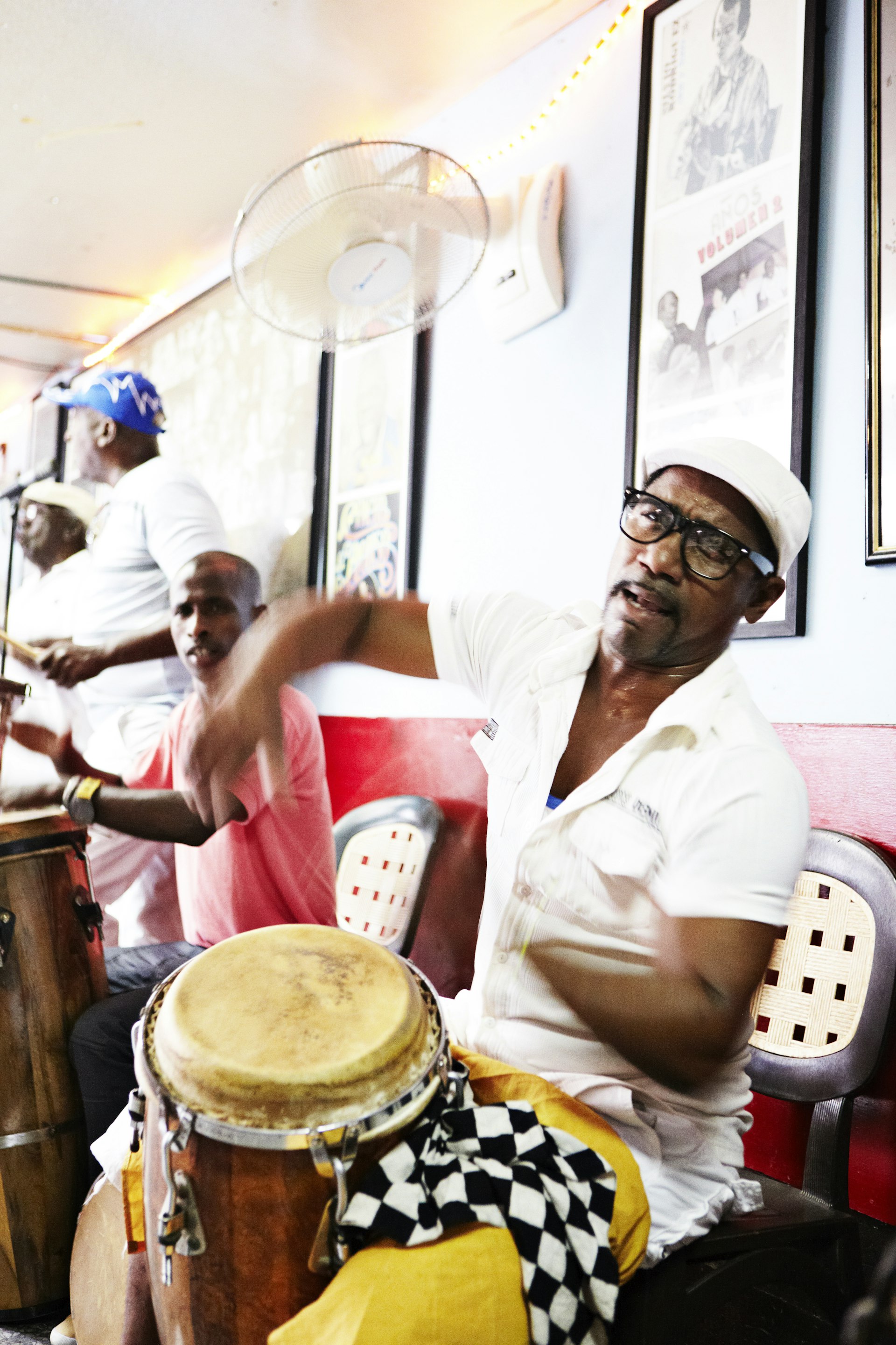Men drumming inside a restaurant