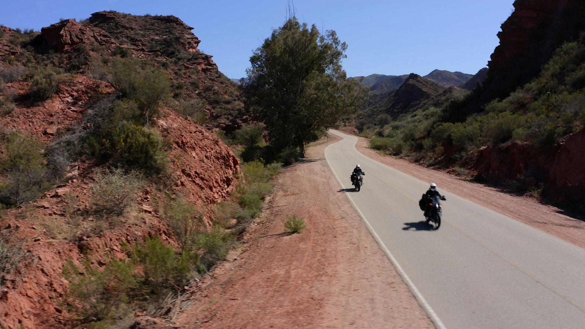 Ewan and Charley riding through the desert