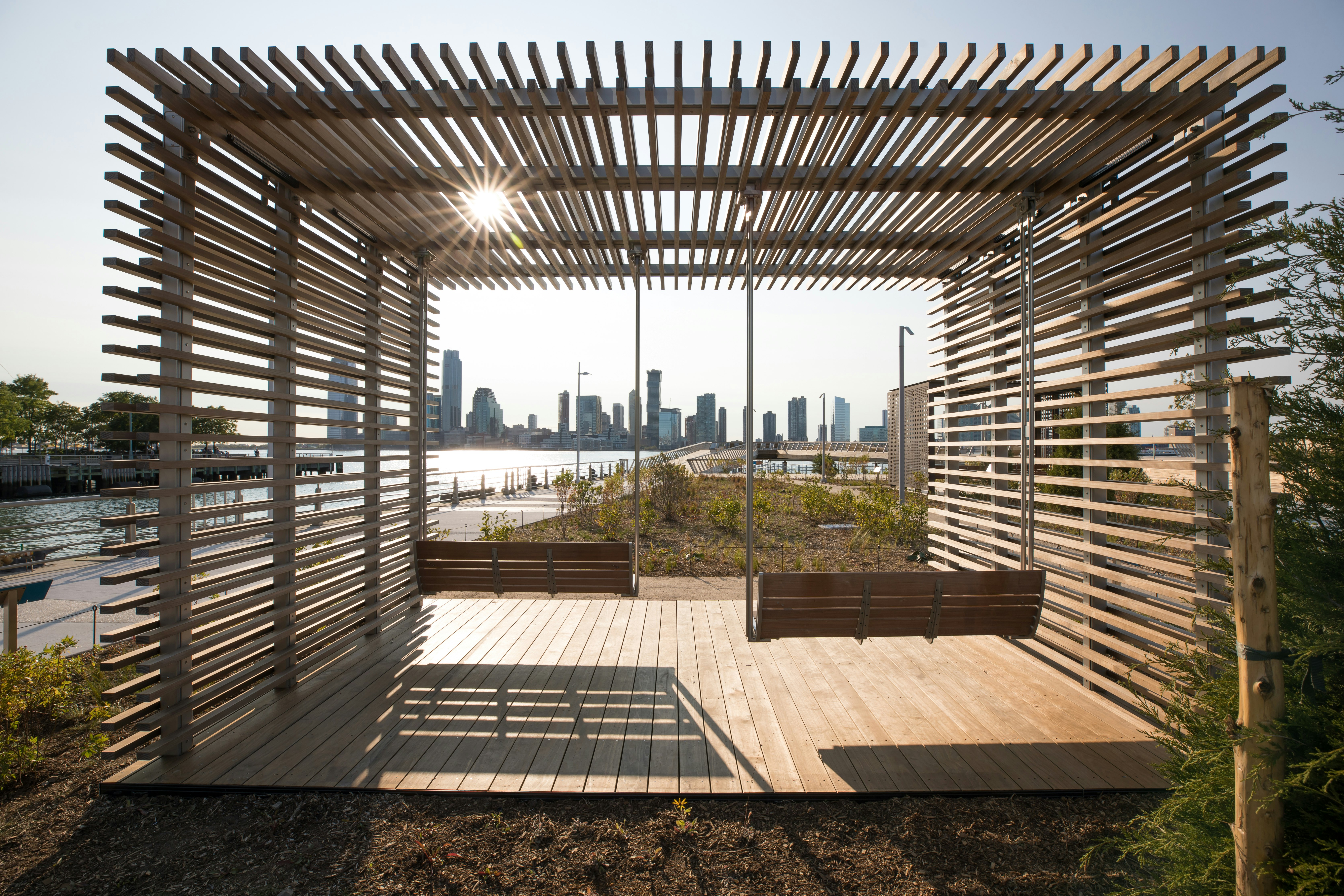 Wooden swings and deck chairs on Pier 26 in New York's Hudson River Park