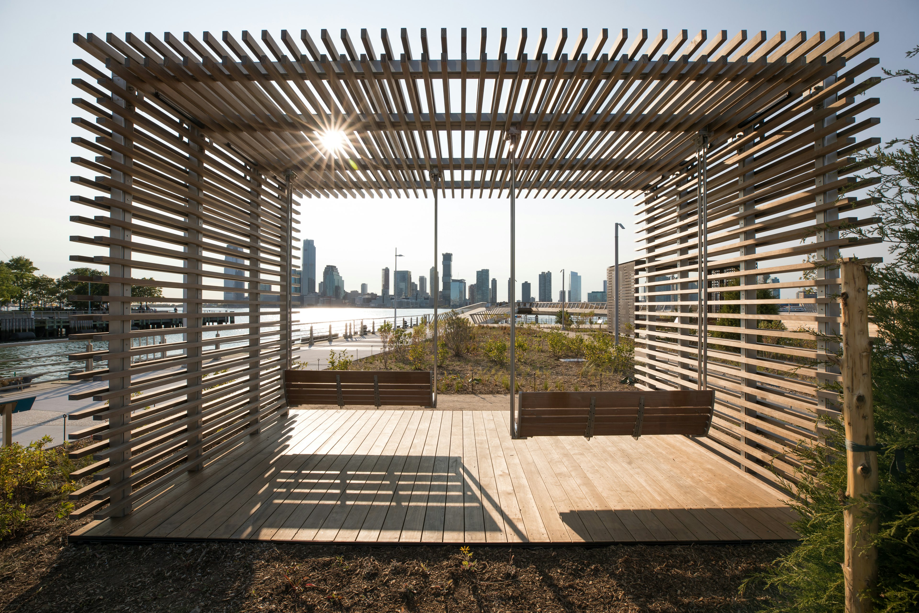 Wooden swings and deck chairs on Pier 26 in New York's Hudson River Park