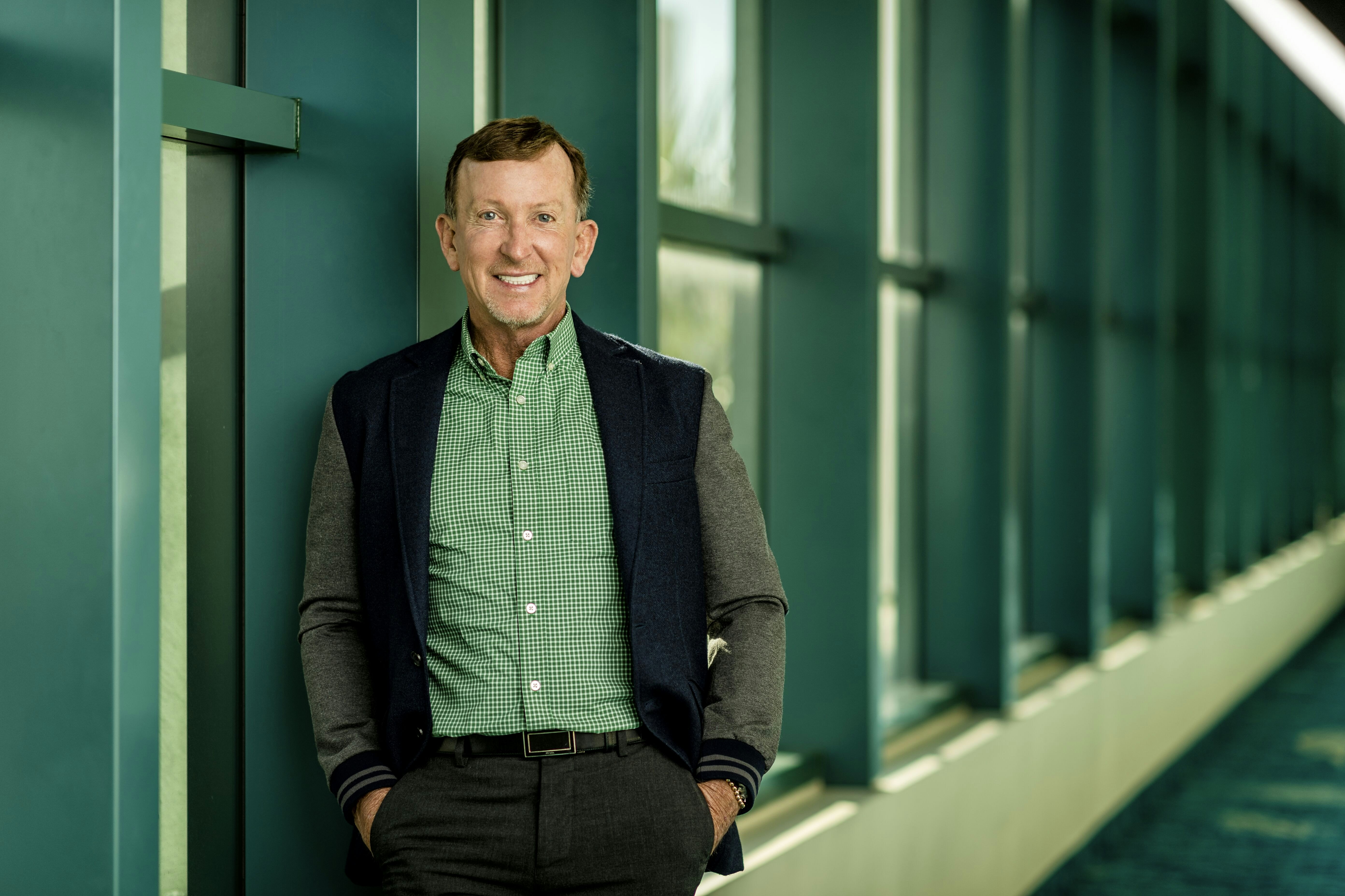 A portrait of a smiling man