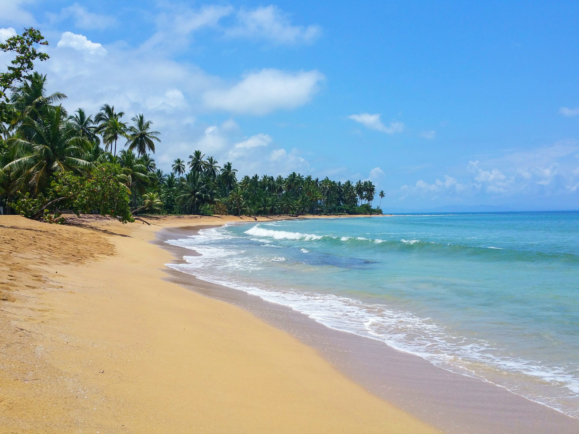 The golden sands of Coson Beach in the Dominican Republic