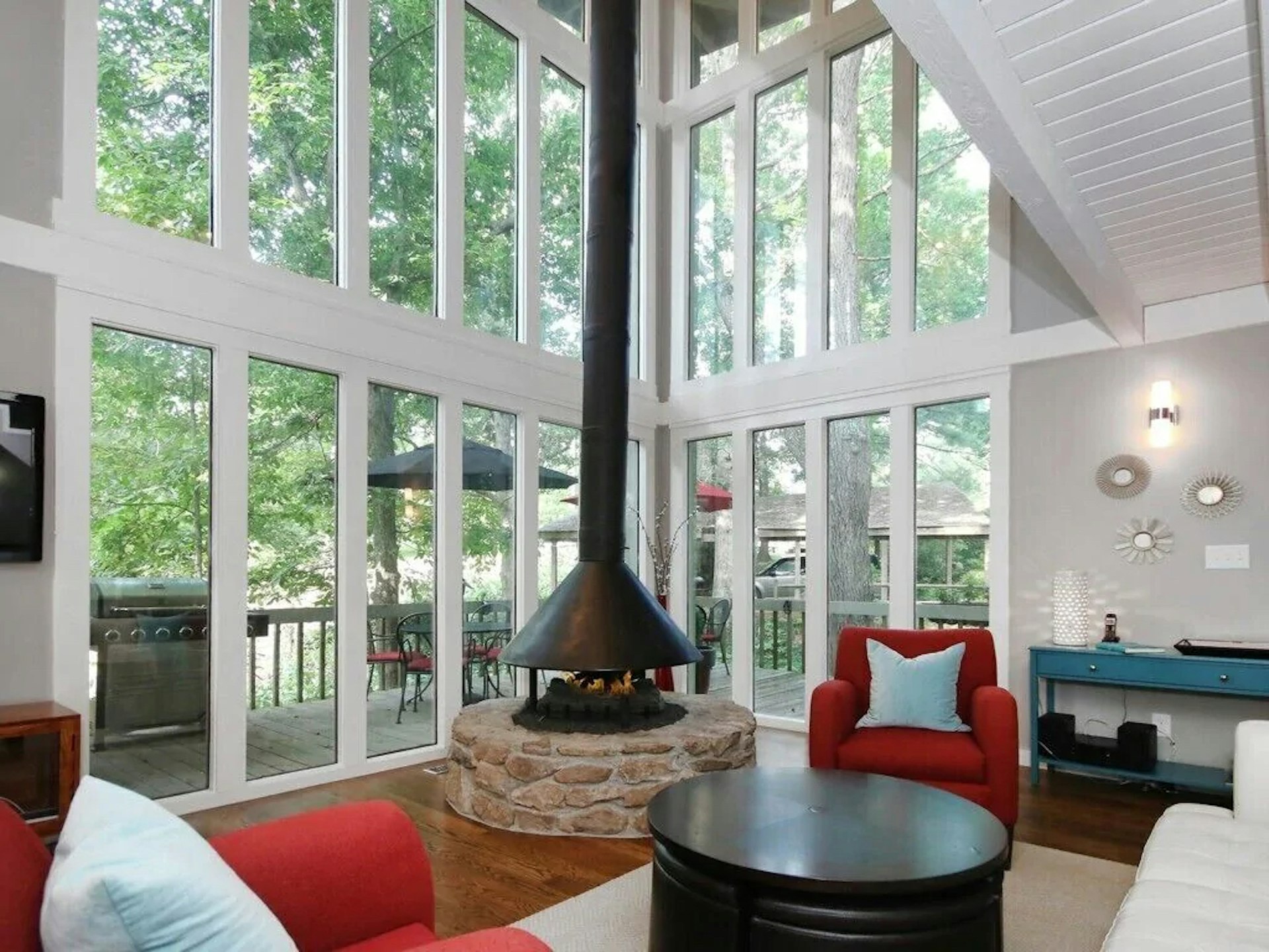 Interior view of the living room and balcony at Tree Tops tree house in Asheville, North Carolina