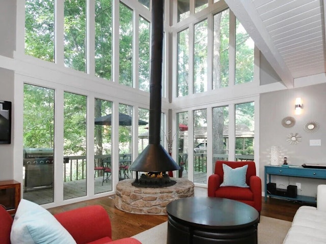 Interior view of the living room and balcony at Tree Tops tree house in Asheville, North Carolina