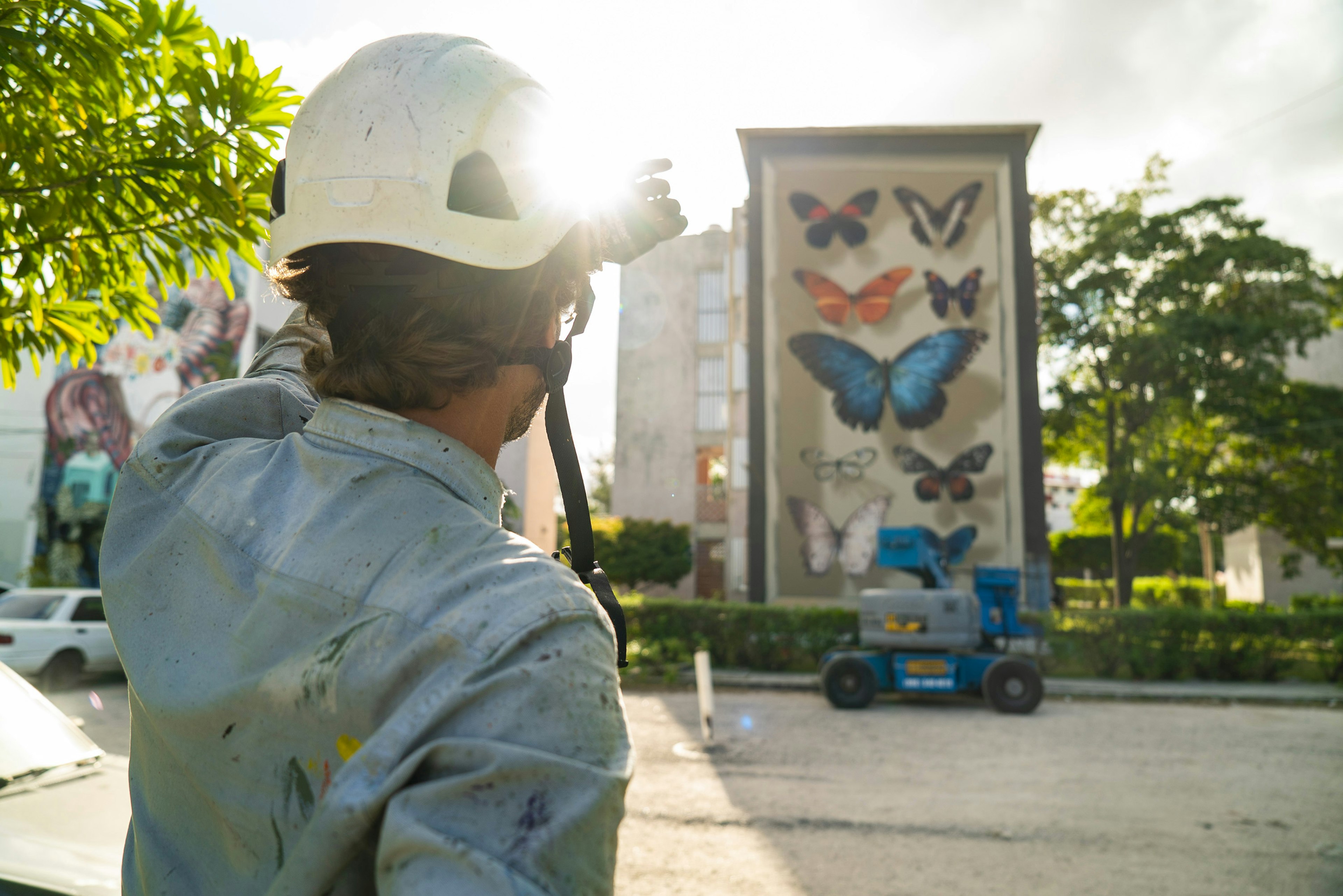 A picture of the artist looking at his work in progress