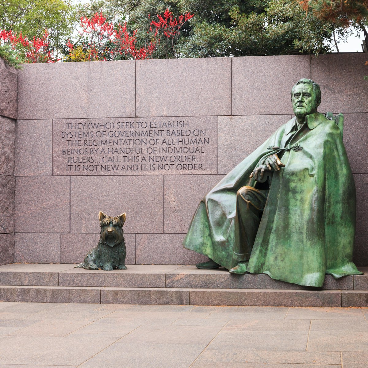 WASHINGTON, DC - NOVEMBER 16, 2014:  The statue of Franklin Delano Roosevelt and his dog on the National Mall in autumn is a major tourist attraction.