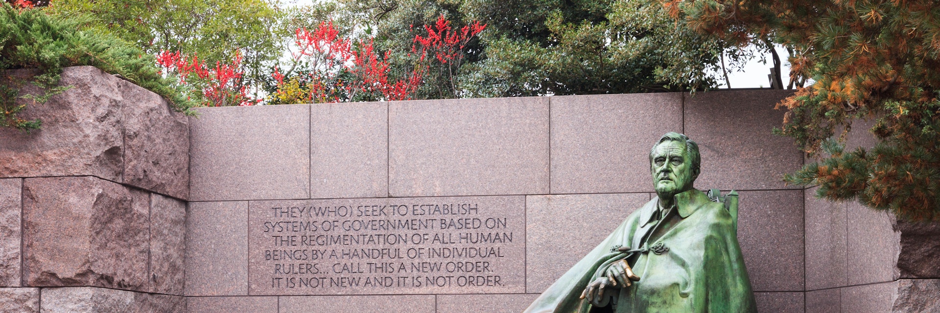 WASHINGTON, DC - NOVEMBER 16, 2014:  The statue of Franklin Delano Roosevelt and his dog on the National Mall in autumn is a major tourist attraction.