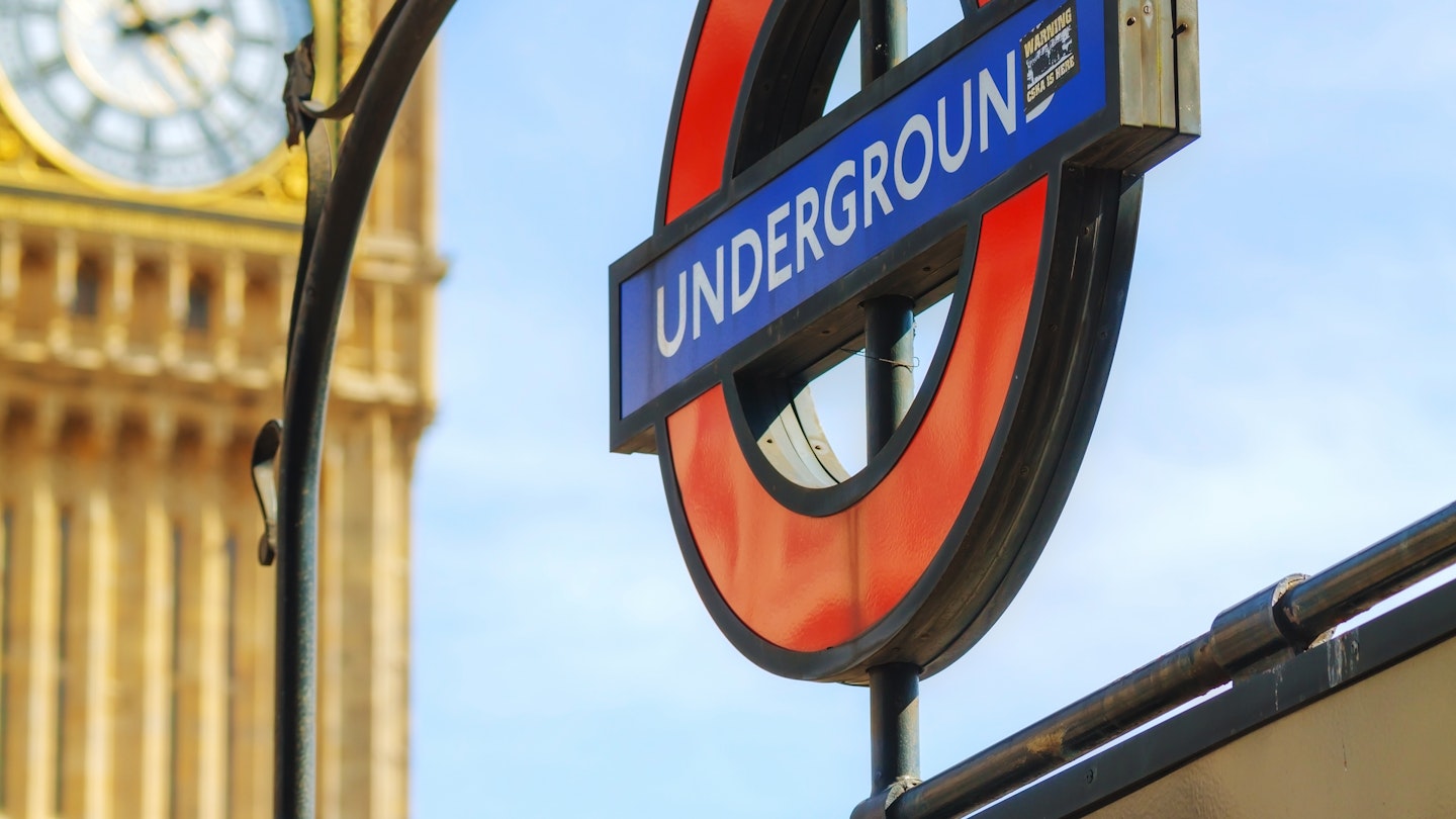 LONDON - APRIL 12: London underground sign at the Westminster station on April 12, 2015 in London, UK. The system serves 270 stations and has 402 kilometres of track, 52% of which is above ground.