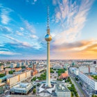 Aerial of Berlin skyline with the Fernsehturm TV tower during sunset.