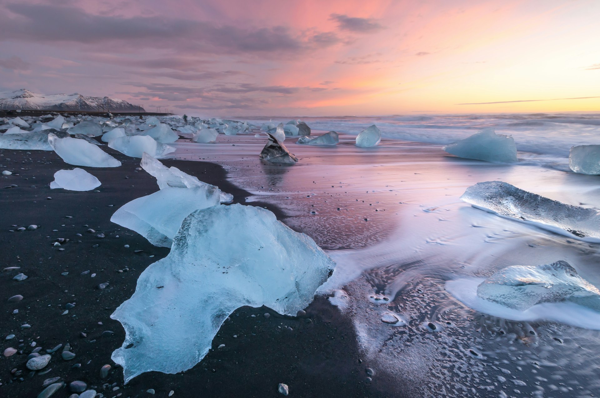 Chunks of ice and icebergs that have washed up on a beach in South Iceland