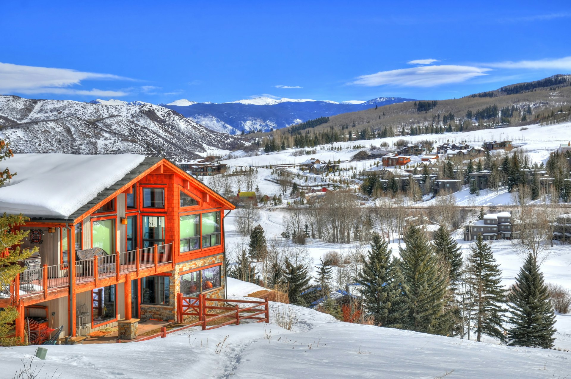 Beautiful colorful landscape in Snowmass - a ski resort with a background of a small residential area (small huts) surrounded by trees (HDR image) in Aspen Colorado