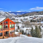 Beautiful colorful landscape in Snowmass - a ski resort with a background of a small residential area (small huts) surrounded by trees (HDR image) in Aspen Colorado