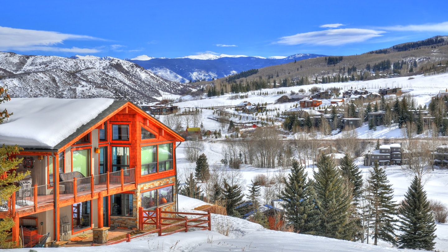 Beautiful colorful landscape in Snowmass - a ski resort with a background of a small residential area (small huts) surrounded by trees (HDR image) in Aspen Colorado