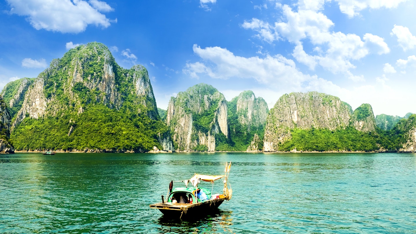 A boat among the karsts at Halong Bay in Vietnam, as seen from Ti Top island.