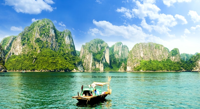 A boat among the karsts at Halong Bay in Vietnam, as seen from Ti Top island.