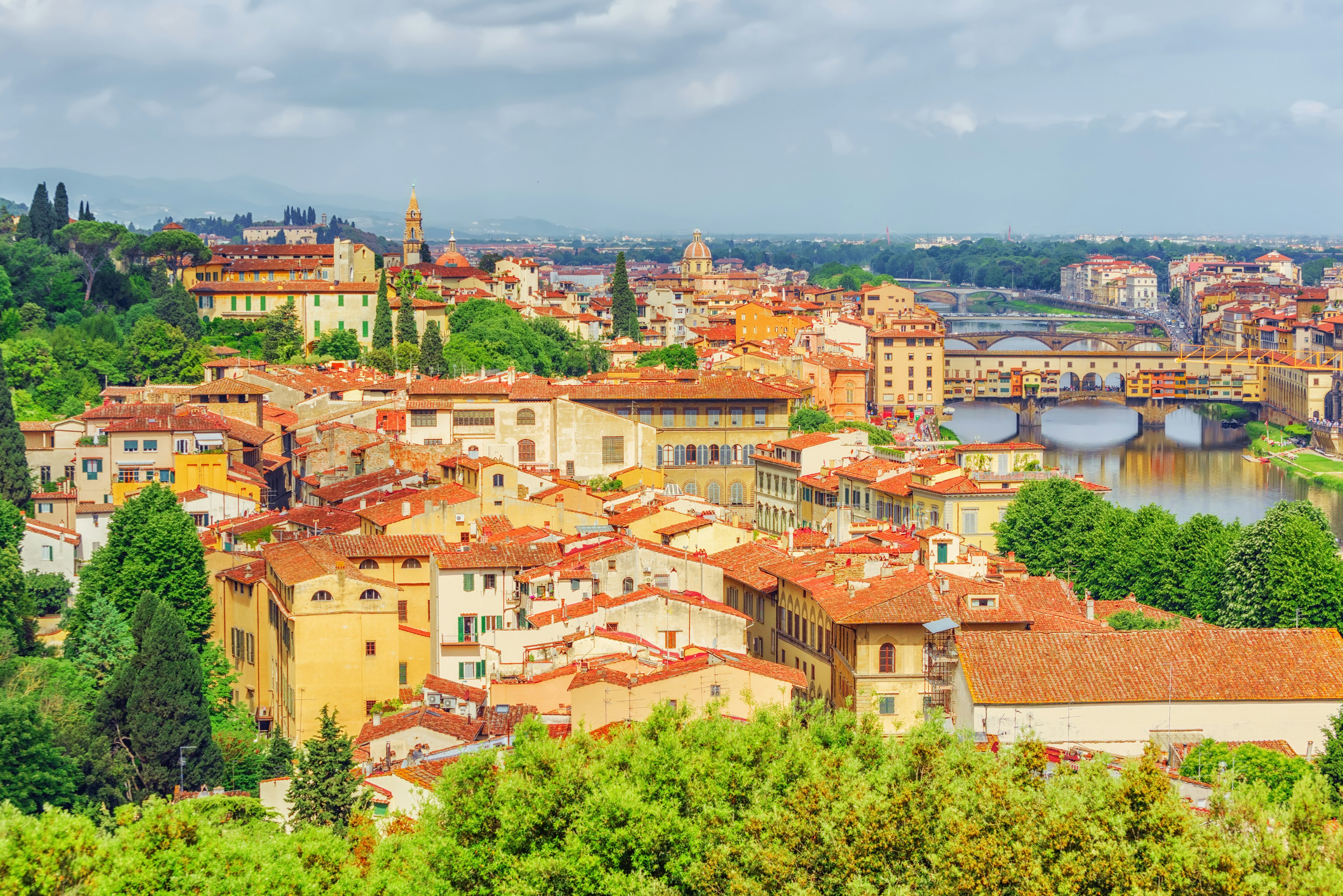 The red-roofed buildings of Florence and the bridges over the river