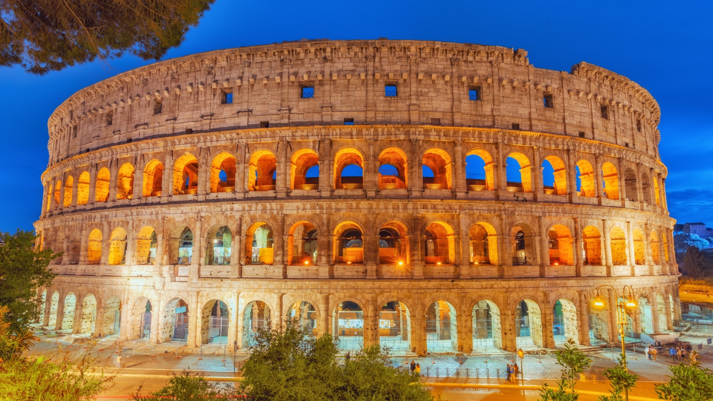 Beautiful landscape of the Colosseum in Rome- one of wonders of the world in the evening time. Italy.